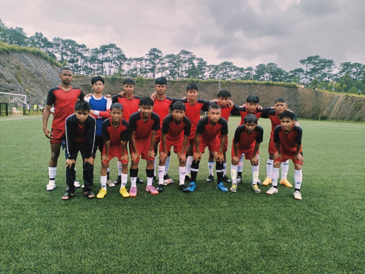 Senior football team on pine-view pitch